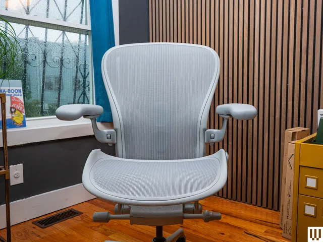 Image may contain: Indoors, Interior Design, Furniture, Chair, Office, and Wood Panels