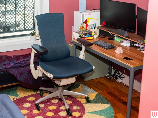 Image may contain: Furniture, Chair, Indoors, Computer, Computer Hardware, Computer Keyboard, Electronics, and Hardware